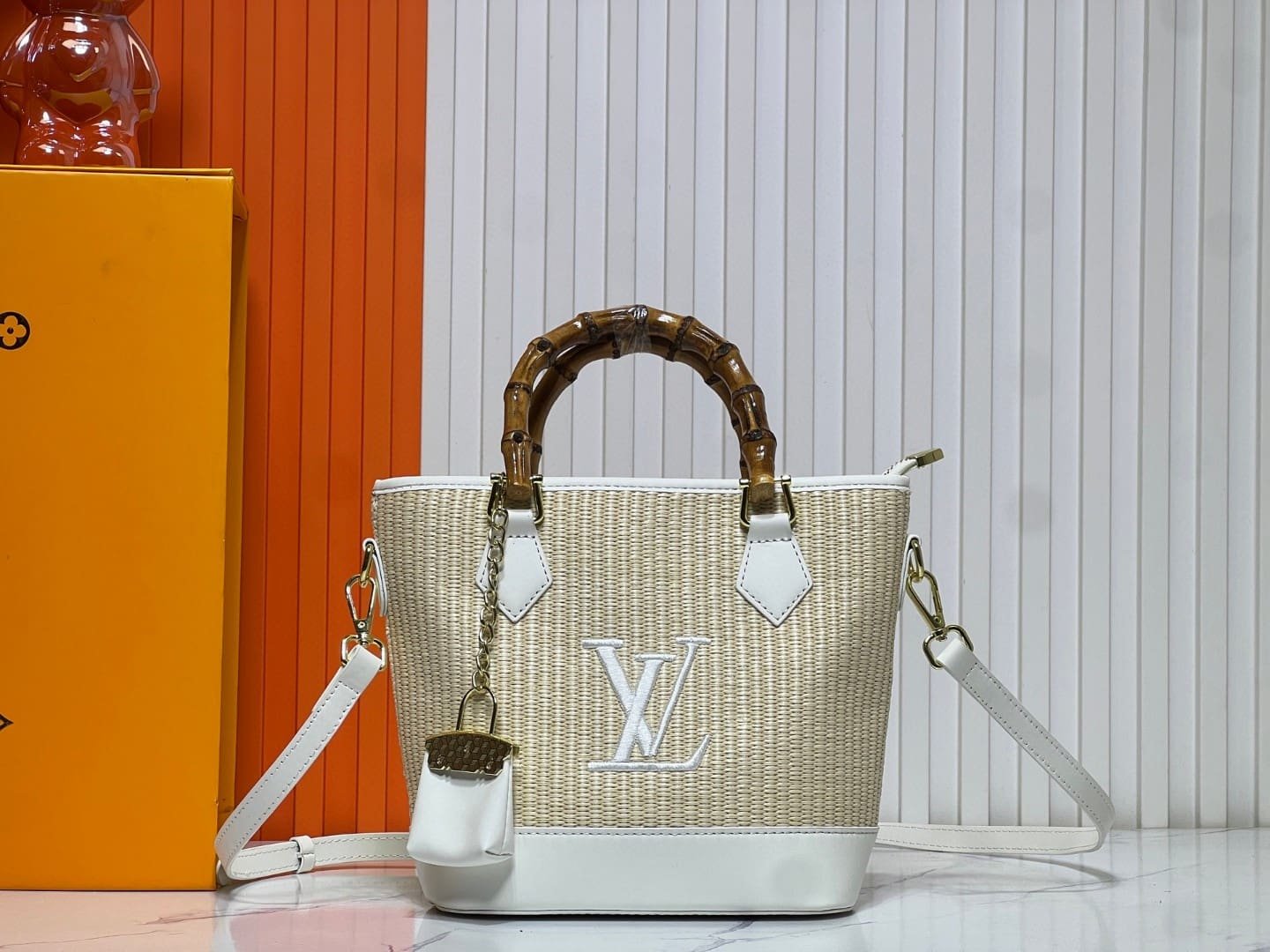 4e3098667d8a1b2b4e798e81740ba691 Louis Vuitton Raffia Petit Bucket Tote - Image 1